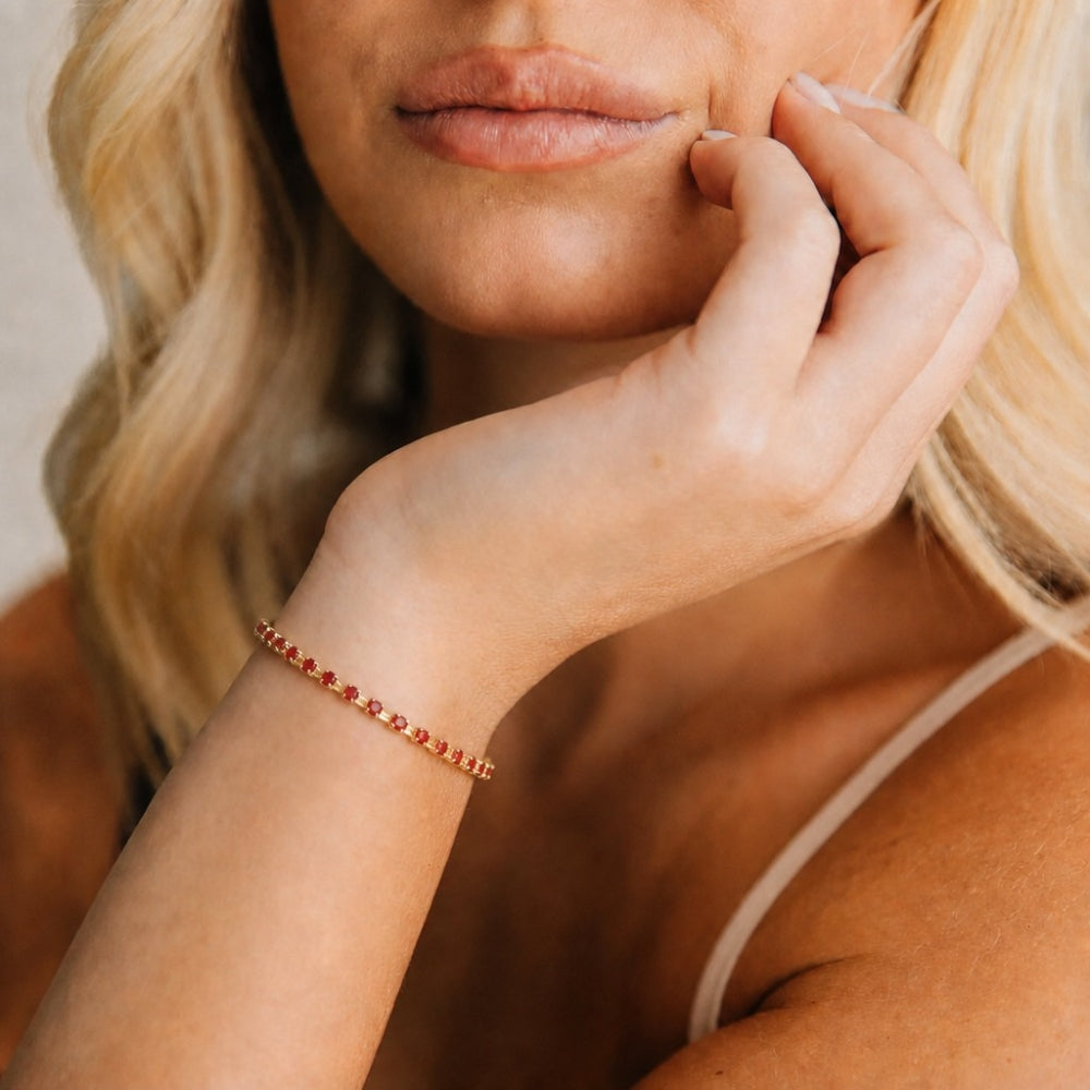 Oro Laminado Tennis Bracelet, Gold Filled Style with Garnet Cubic Zirconia, Polished, Golden Finish